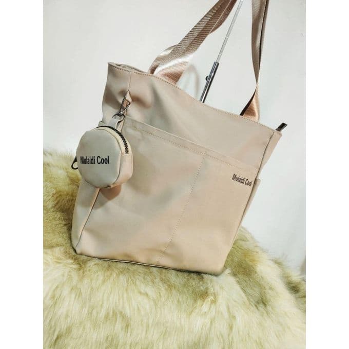 Practical tote bag made of synthetic leather with a small pocket, very practical