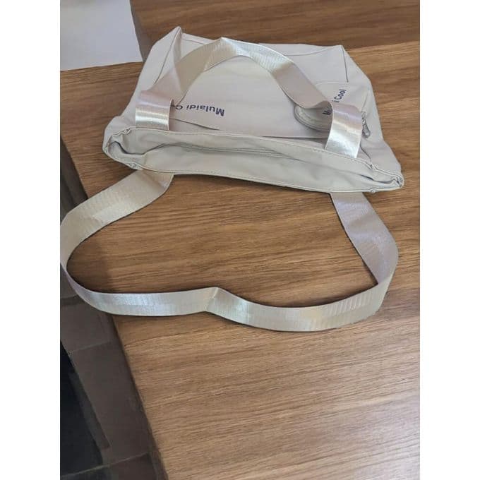 Practical tote bag made of synthetic leather with a small pocket, very practical