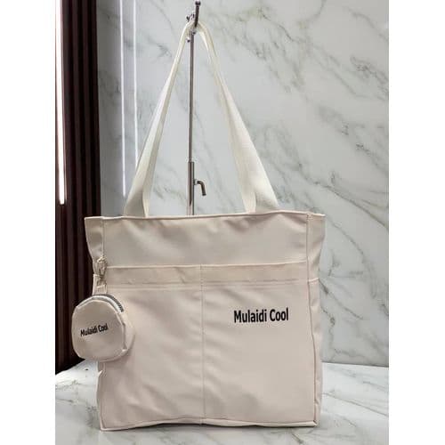 Practical tote bag made of synthetic leather with a small pocket, very practical