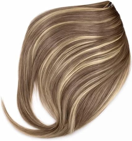 Natural hair extensions in brown with blonde highlights and front bangs 