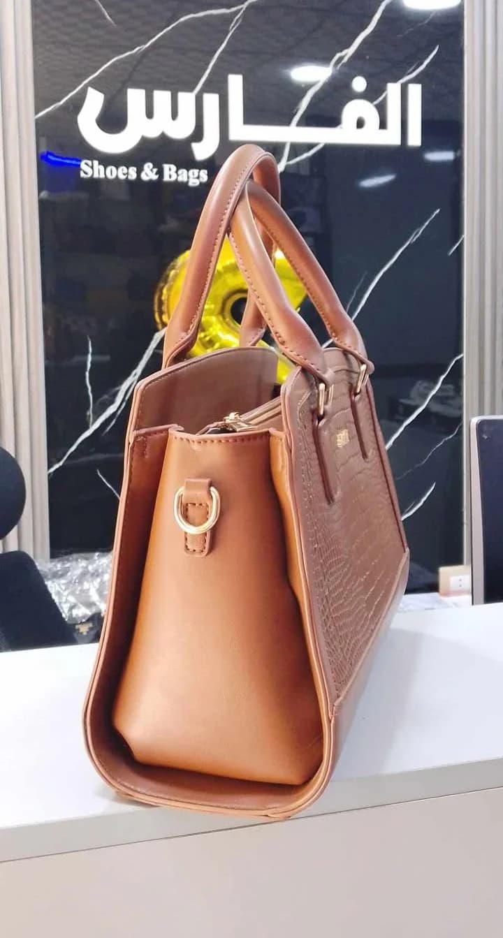 Women's handbag with crocodile print design