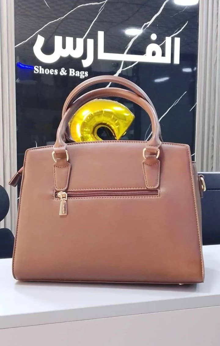 Women's handbag with crocodile print design