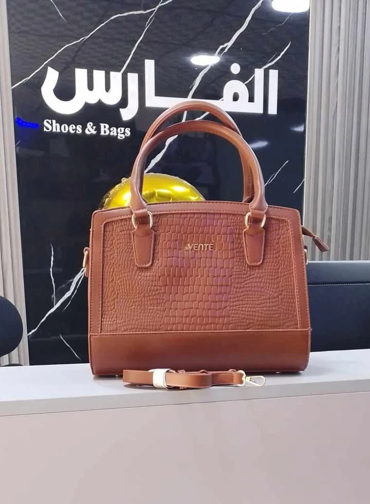Women's handbag with crocodile print design