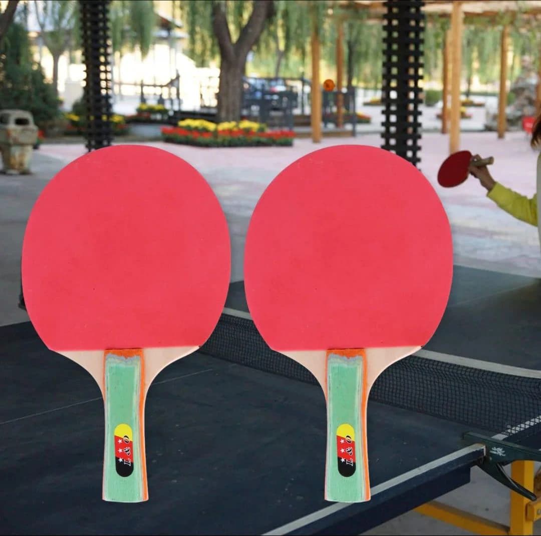 Two ping pong rackets + three table tennis balls ( Color may vary )