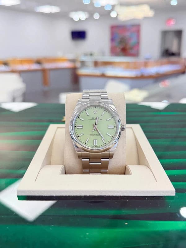 Rolex Oyster Perpetual watch with a pistachio green dial